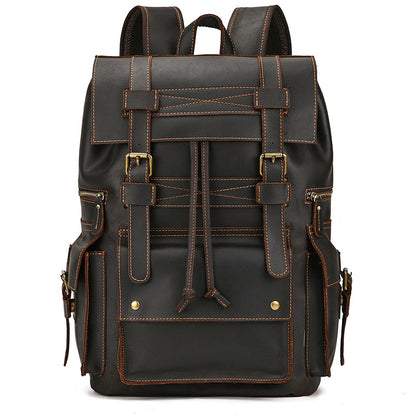 Black leather backpack with brown stitching on a white background