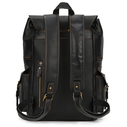 Black leather backpack with gold accents on a white background