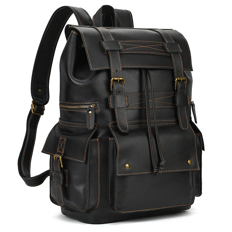 Black leather backpack with gold accents on a white background