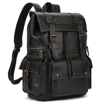 Black leather backpack with gold accents on a white background