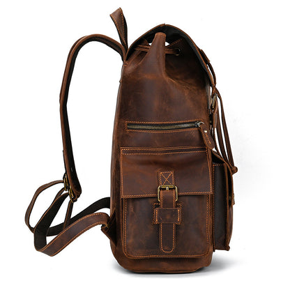 Brown leather backpack on a white background