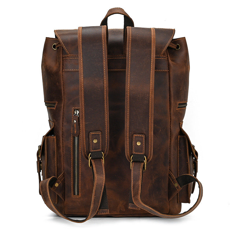 Brown leather backpack on a white background