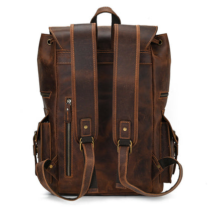 Brown leather backpack on a white background