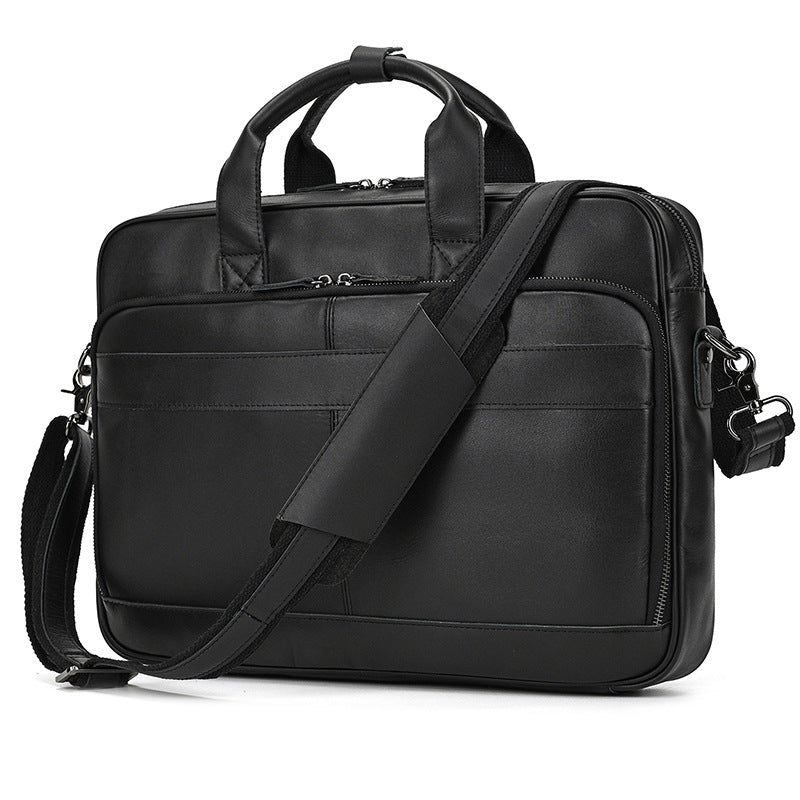 Black leather briefcase with shoulder strap on a white background