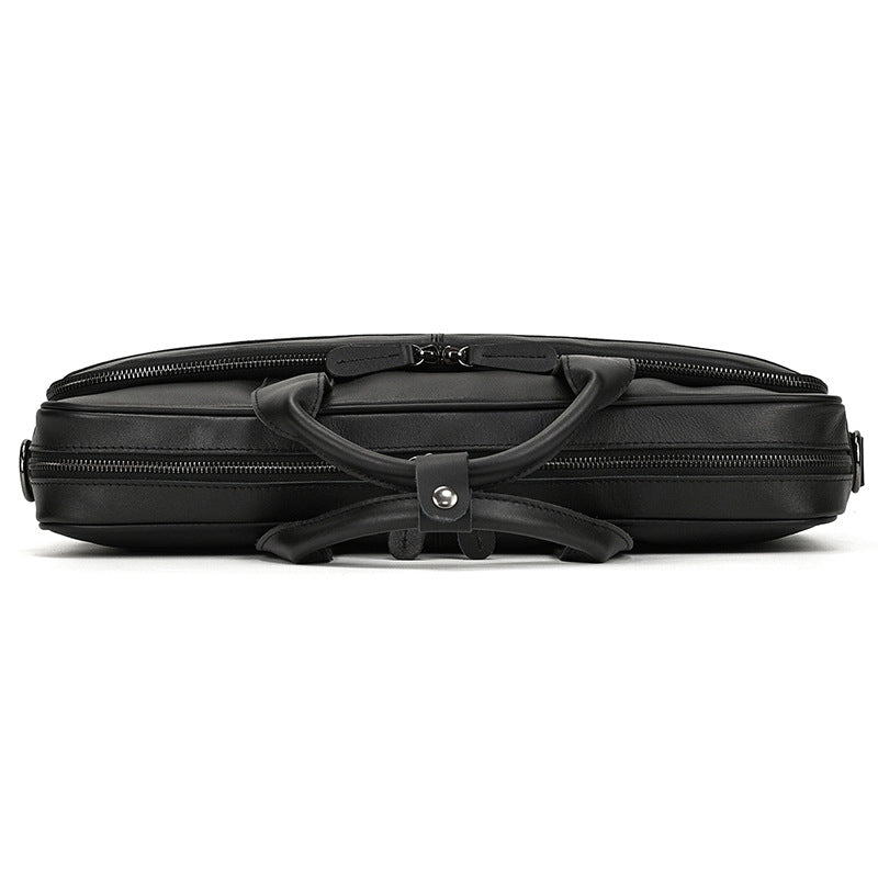 Black suitcase with handle on a white background