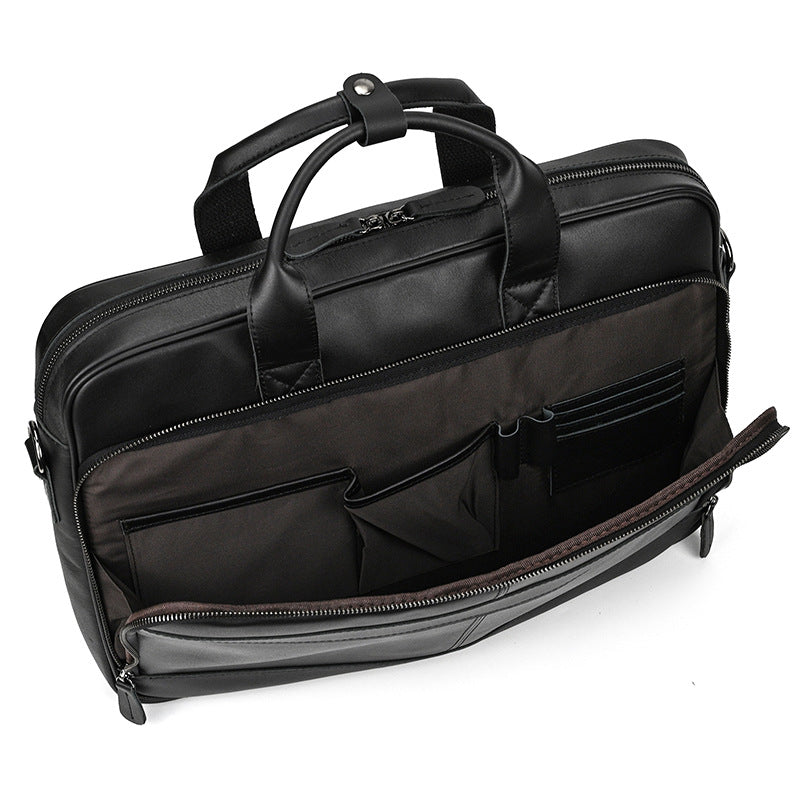 Black leather briefcase with multiple compartments on a white background