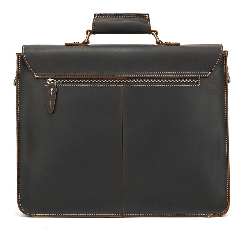 Rear view of the minimal dark brown leather briefcase featuring a full-width zippered back compartment.