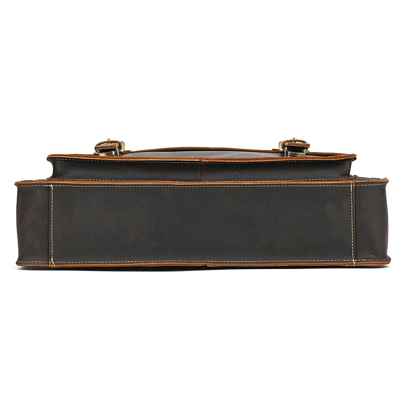 Bottom view of handcrafted slim leather business bag with precise stitching and streamlined base.