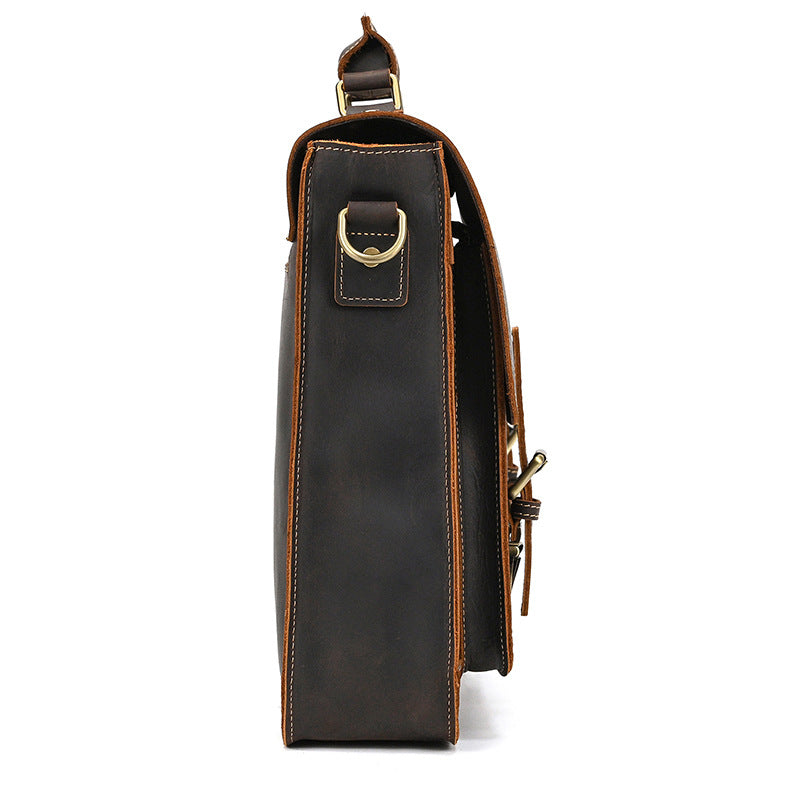 Side profile of dark brown vintage leather briefcase highlighting the antique brass D-ring and slim construction.