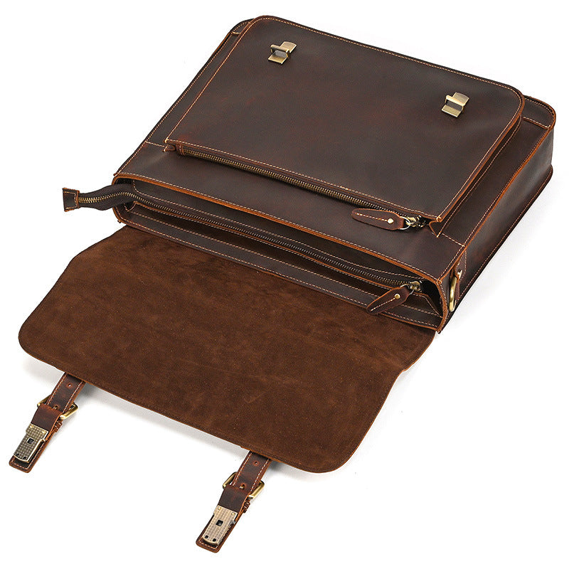 Brown leather briefcase with gold accents on a white background