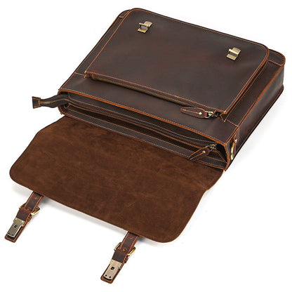 Brown leather briefcase with gold accents on a white background