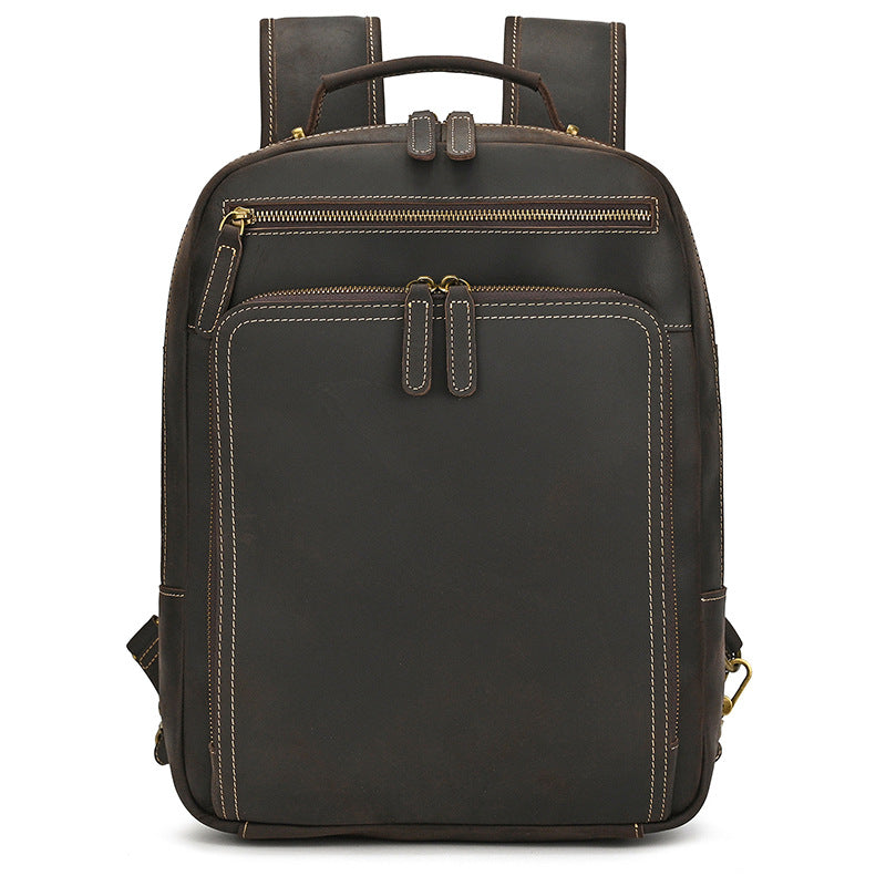 Dark Brown leather backpack with gold zippers on a white background