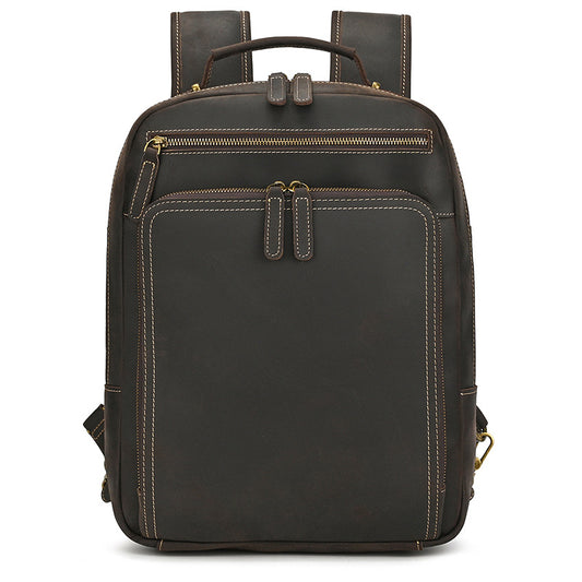 Dark Brown leather backpack with gold zippers on a white background
