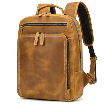 Brown leather backpack on a white background