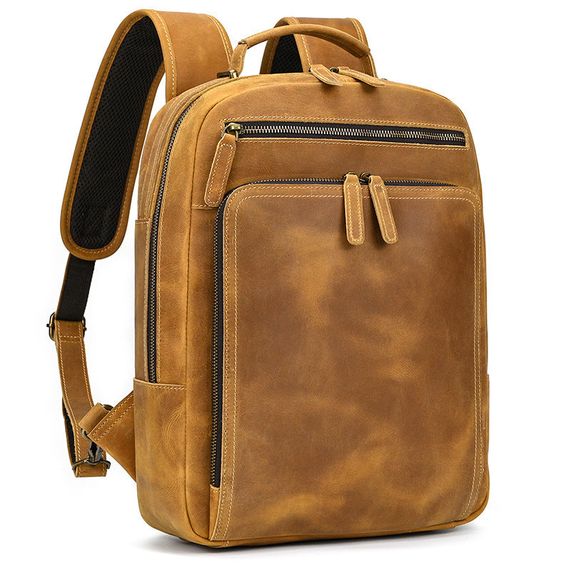 Brown leather backpack on a white background