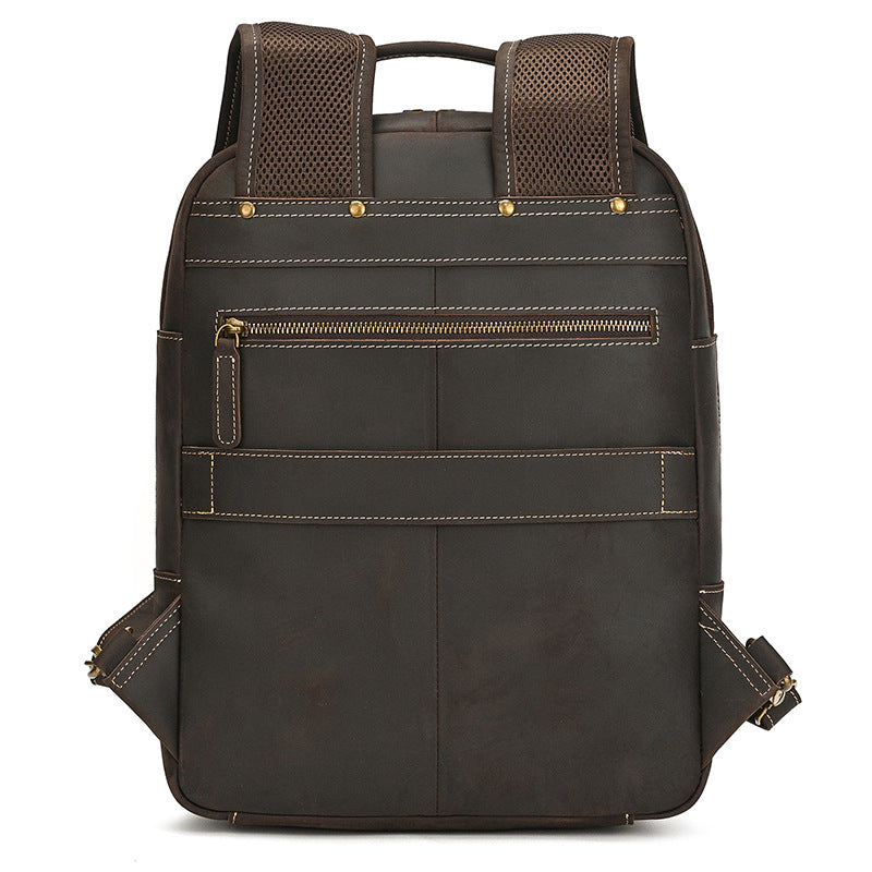 Dark Brown leather backpack with gold zipper on a white background