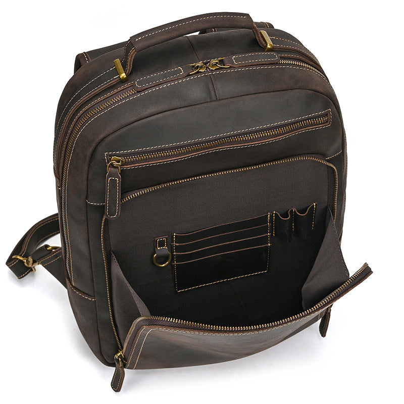 Dark Brown leather backpack with multiple pockets and zippers on a white background
