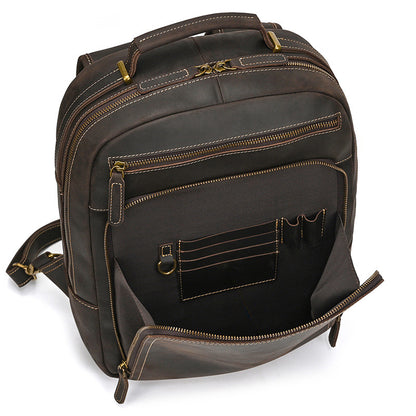 Dark Brown leather backpack with multiple pockets and zippers on a white background