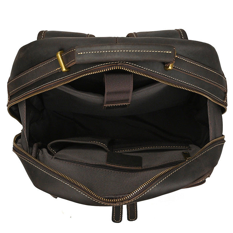 Dark Brown leather backpack with gold stitching on a white background