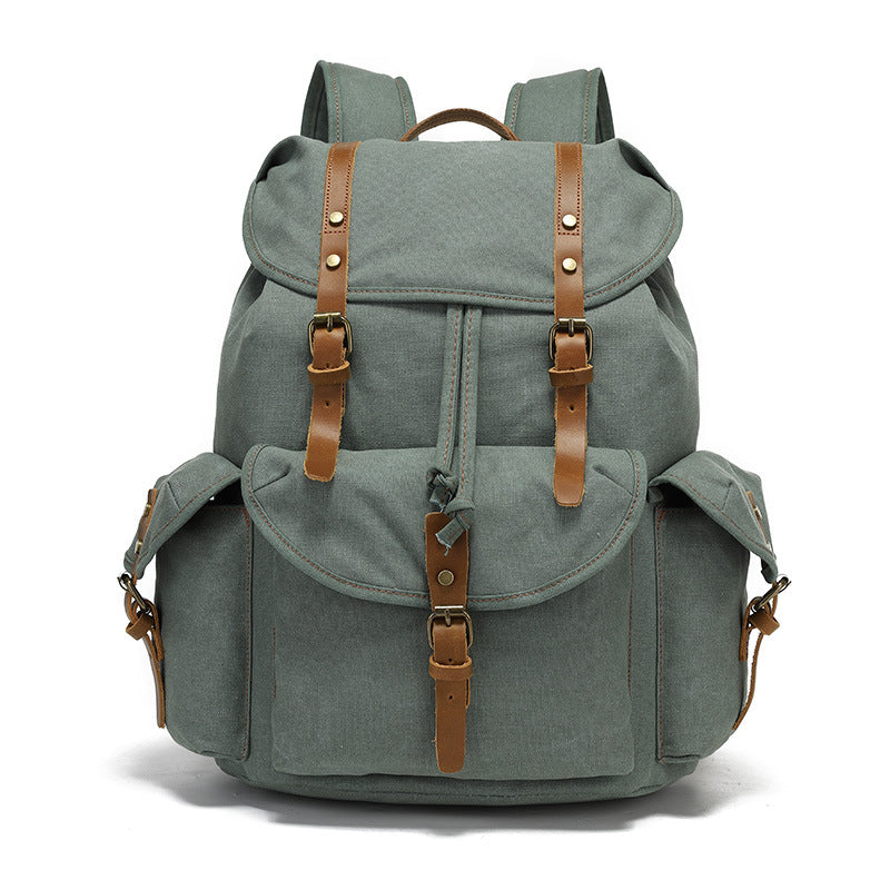 Front view of the Timbercarry vintage canvas multi-pocket backpack in grey, featuring durable canvas material, leather straps, and multiple storage compartments.