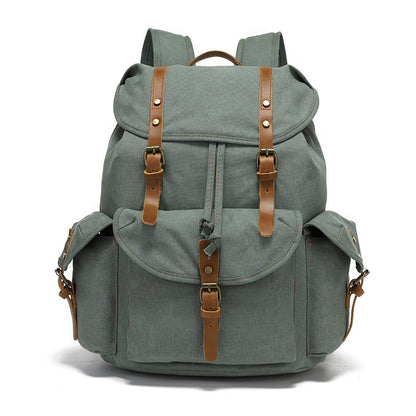 Front view of the Timbercarry vintage canvas multi-pocket backpack in grey, featuring durable canvas material, leather straps, and multiple storage compartments.