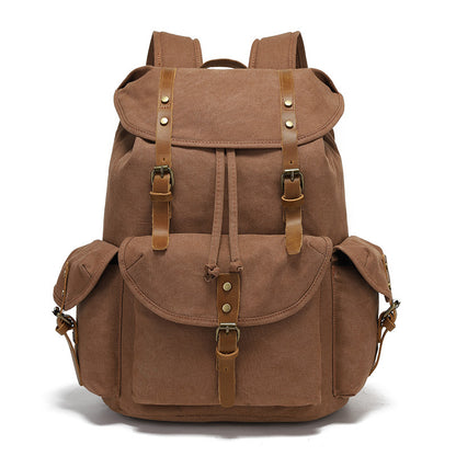 Front view of the Timbercarry vintage canvas multi-pocket backpack in brown, highlighting the classic vintage aesthetic with premium leather accents and brass buckles.