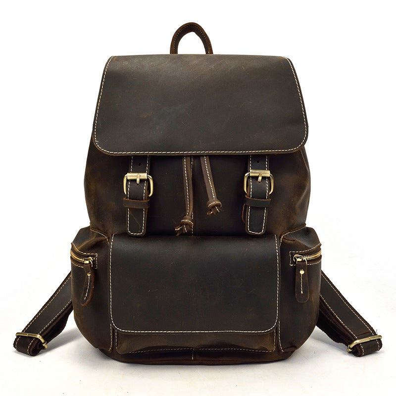 Brown leather backpack on a white background
