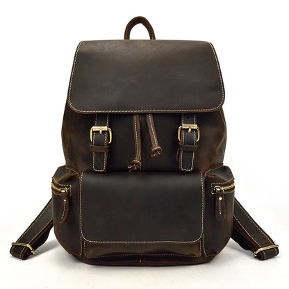 Brown leather backpack on a white background