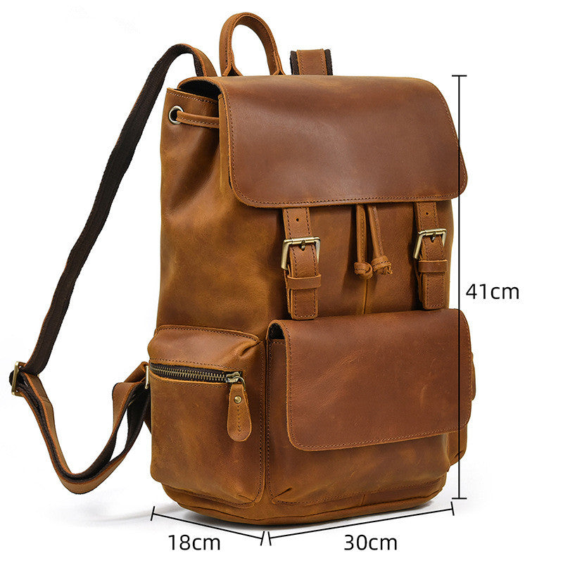 Brown leather backpack with measurements on a white background