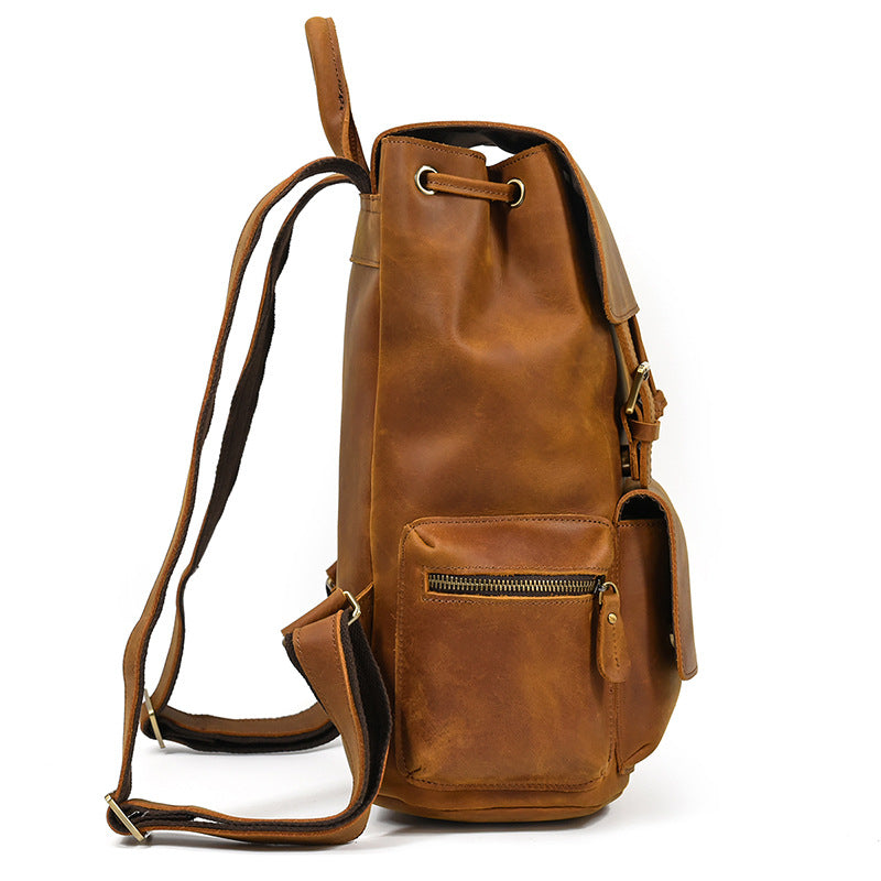 Brown leather backpack on a white background