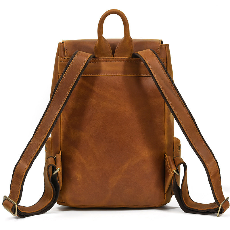 Brown leather backpack on a white background