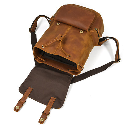Brown leather backpack on a white background