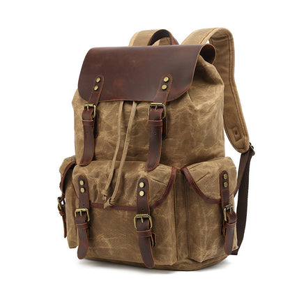 Vintage Waxed Canvas Multi-Pocket Rucksack in earth brown, displaying its rugged waxed canvas texture and vintage-style leather accents.