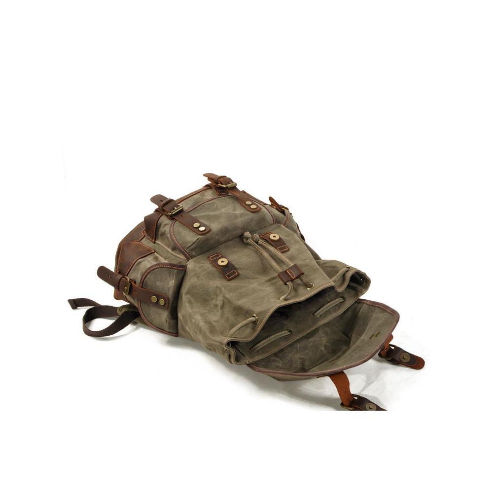 Vintage-style backpack with leather straps on a white background