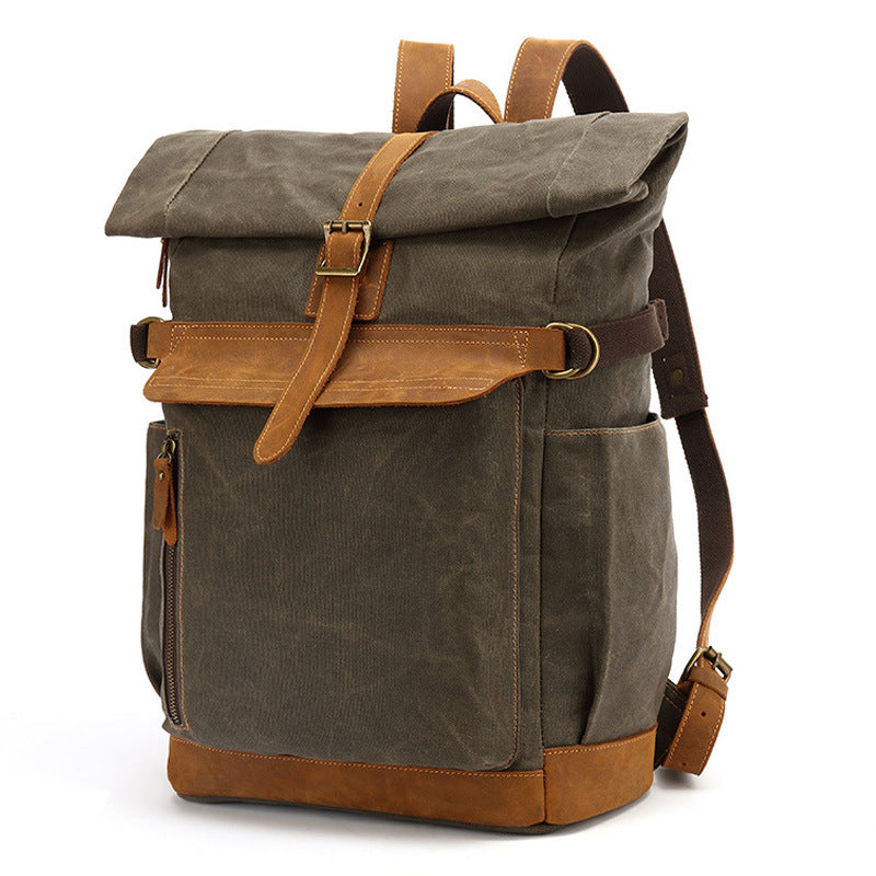 Vintage style army green waxed canvas rolltop backpack with leather accents