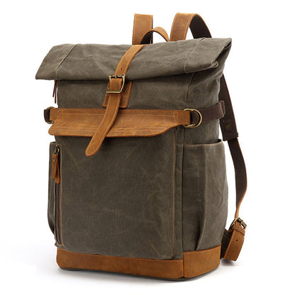 Vintage style army green waxed canvas rolltop backpack with leather accents