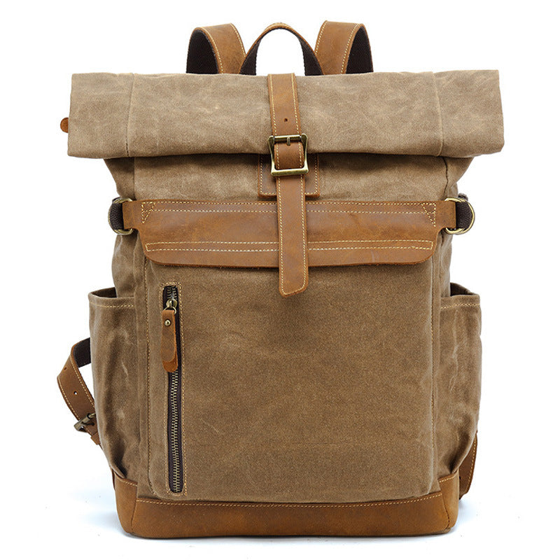 Classic brown waxed canvas rolltop backpack suitable for travel and daily use