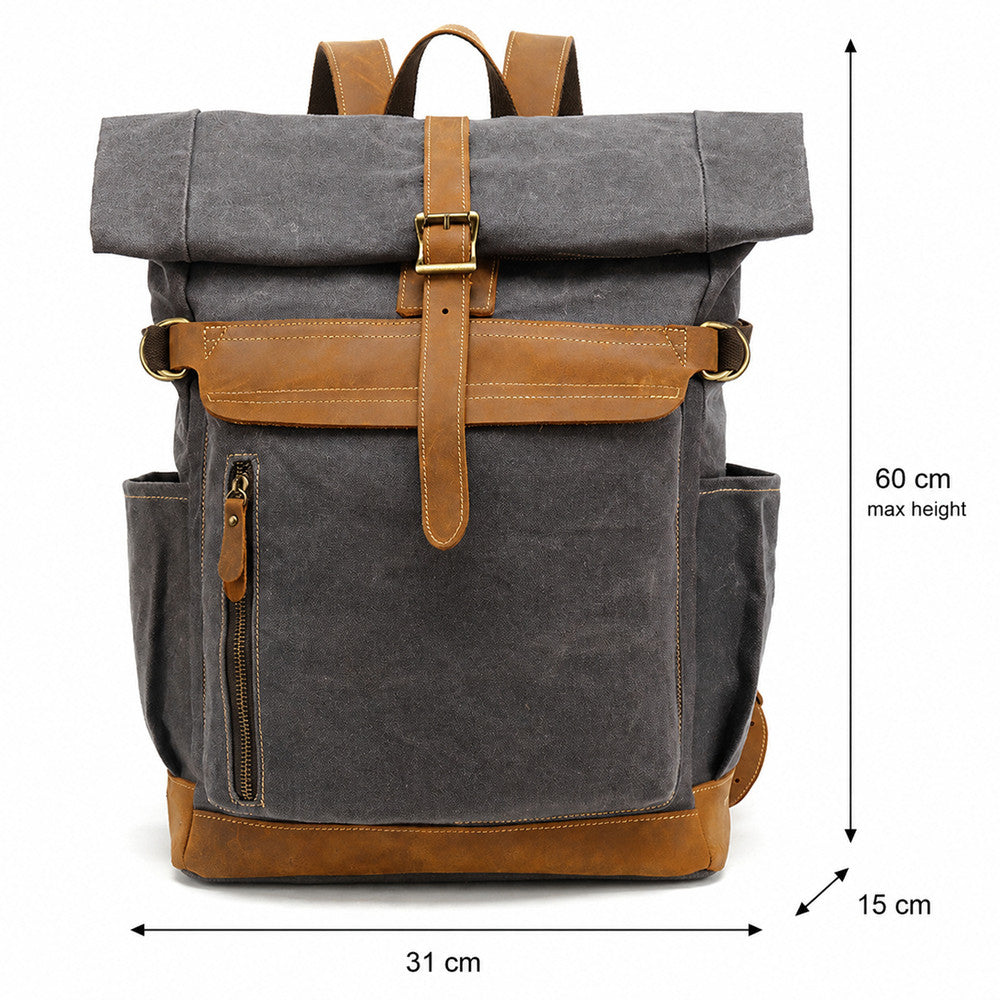 Dark grey vintage waxed canvas rolltop backpack with brown leather details