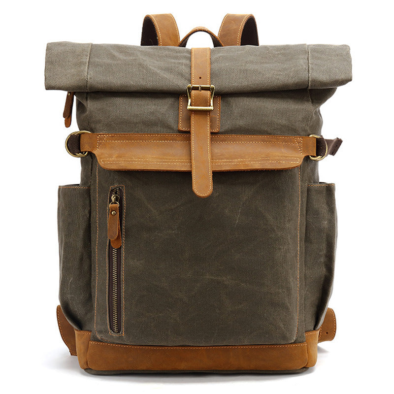 Front view of army green rolltop backpack made of waxed canvas and leather